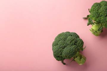 Broccoli cabbage on a pink background. Pattern of fresh broccoli cabbage.