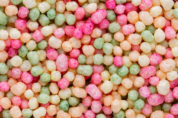 Thousands sprinkles tiny sugar beads for decorating cakes and desserts background.