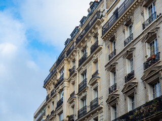 Fototapeta na wymiar Paris, France - November 14th 2021: Typical historic facade of a housing building