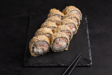 Japanese cuisine -Hot fried Sushi Roll with salmon, avocado and cheese. Sushi menu. 