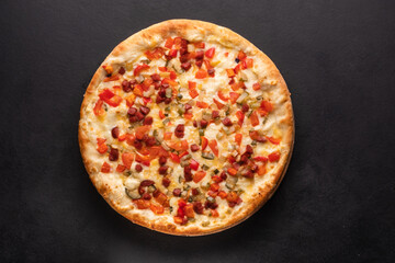 Homemade pizza with ham, cheese, tomatoes. Italian food, natural ingredients.