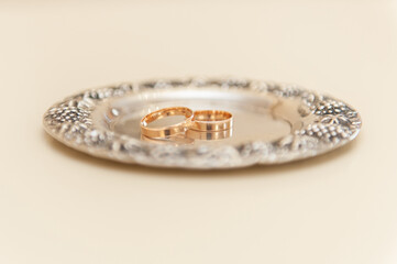 Wedding rings on a saucer