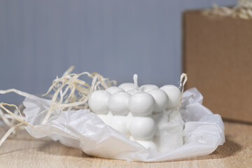 Trendy Soy Wax Cube Bubble Candle on light background, Interior object