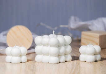 Trendy Soy Wax Cube Bubble Candle on light background, Interior object