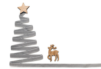 Christmas tree made of ribbon with a star on a white background. Place for your text.
