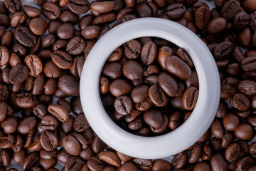 coffee beans in a white cup