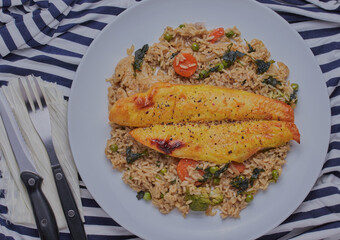 Smoked basa fillet with curried rice and vegetables.