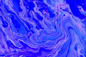 Abstract ultramarine marble background with mixed paint. Acrylic texture with marble pattern. Mixing colors creates an interesting structure. It is well suited for laptop background and wallpaper, fab