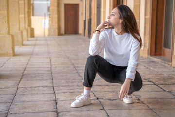 Portrait of young woman on street serene concept