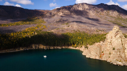 the boat on the lake in the mountains