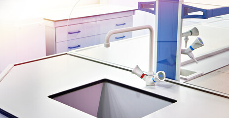 Fototapeta na wymiar Water taps in chemical laboratory