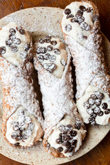 Directly above shot of  sicilian cannoli  with chocolate chips