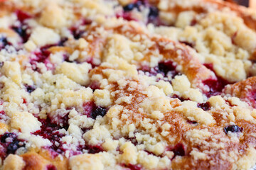 Fruit tart covered with crumble.