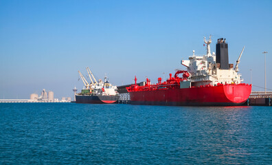 Red tanker ship is loading in port of Saudi Arabia