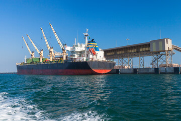 Bulk carrier, cargo ship is loading in port