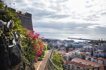 Fototapeta na wymiar view of the ocean coast of a European city and part of the fortress