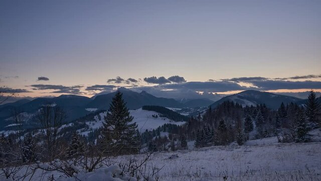 Winter landscape at sunset, dusk, colorful sky