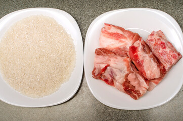Raw meat and rice grits. Ingridinets for cooking at home.