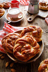 Homemade traditional cinnamon - cardamom sweet buns on a rustic table