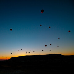 Hot air balloons. Silhouette of hot air balloons at sunrise in Cappadocia
