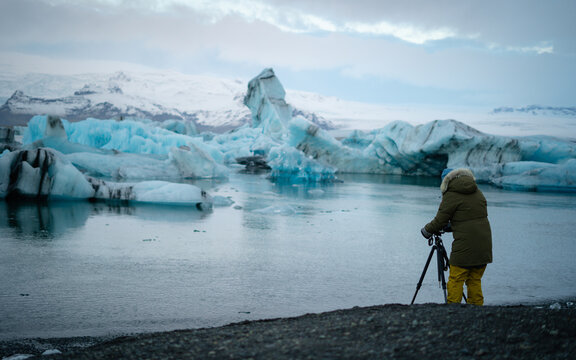 Photographer shooting the Jokulsarlon Glacial Lagoon in Iceland.