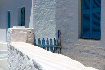 Traditional aegean greek island buildings, houses of greece islands, white walls, blue windows and...
