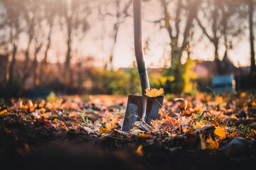 Gardener digging in a garden with a spade. Big shovel close up.