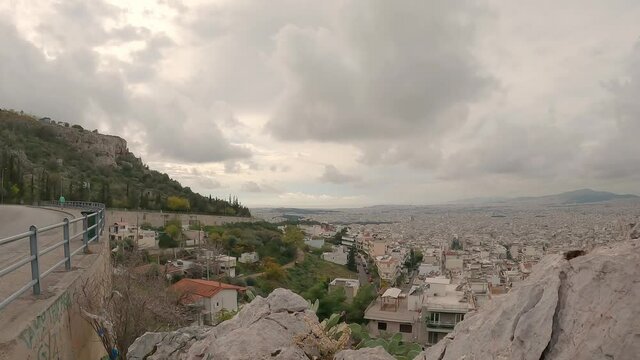 Time lapse video from high angle shows the city of Athens on a cloudy day.