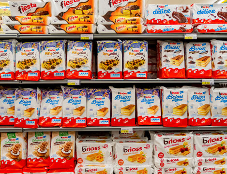 Fossano, Italy - November 25, 2021: Ferrero Kinder, Fiesta, Delice, brioss e Pan e Cioc products displayed on the supermarket shelf