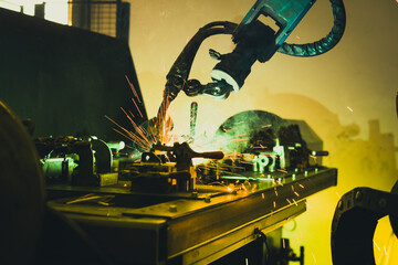 Robot welding a piece of steel. 