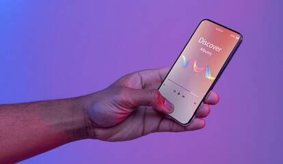 Black Male Hand Holding Smartphone With Opened Music Player App On Screen
