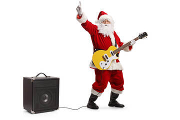 Santa claus dancing and playing an electirc guitar plugged into an amplifier