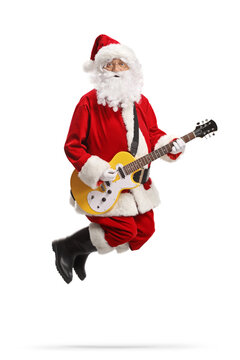 Santa claus jumping and playing a yellow electirc guitar