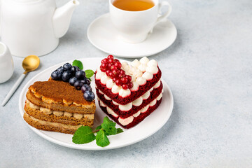 Sweet hearts. Red velvet cake and honey cake in heart shape.