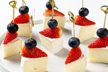 Delicious canapes with camambert sheese and strawberry