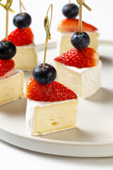 Delicious canapes with camambert sheese and strawberry