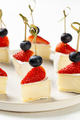Delicious canapes with camambert sheese and strawberry