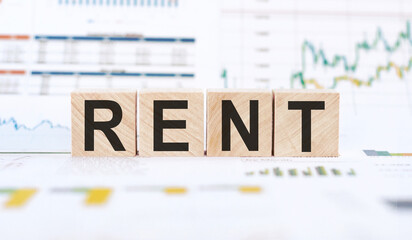 Rent text on wooden blocks on a white background