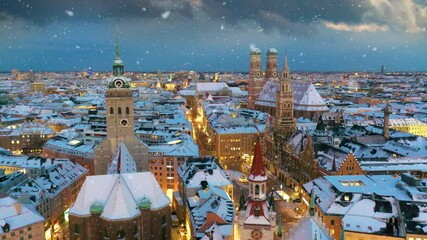 Munich skyline aerial drone video at winter snow falling munich marienplatz sqaure franuenkirche church , cathedral birds vew, munich winter city germany. - Powered by Adobe