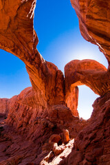 "Double Arch" with blue sky and red sandstone, Archs National Park, Moab, Utah