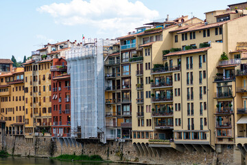 facades of traditional italian buildings by the river Arno, Florence, Italy