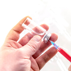 Mixing the medicine with blood. Preparing for vaccination. Prevention of viral disease.