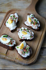 Selective focus. Toast with tuna and egg. Healthy toast. The keto diet.