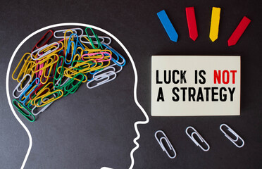 Luck is not a strategy text on wood background