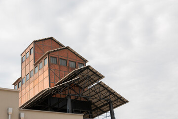 The historical gashouse undergoing restoration and turn into a museum and cultural center.  Magnificent restored building standing out. Gashouse invites visitors to explore industrial heritage.