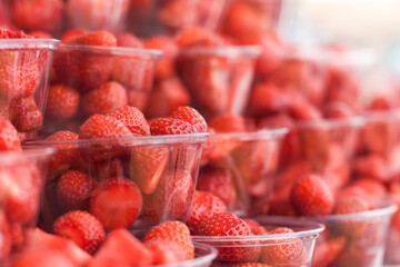 Strawberry buffet selection. Fresh, clean and prepared strawberries in clear punnet containers. Often found at a snack bar or traditional food at the annual Wimbledon tennis event.