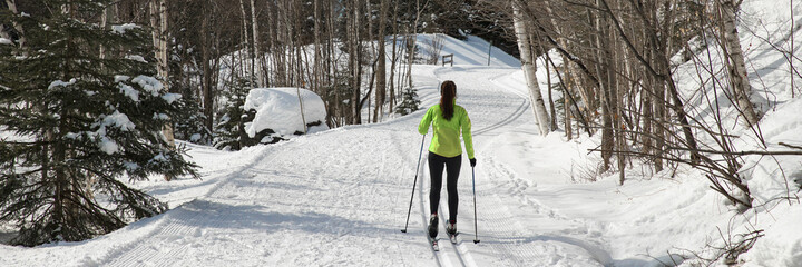 Cross-country skiing classic technique. Skiing Woman in Classic Style Nordic Skiing in winter doing...