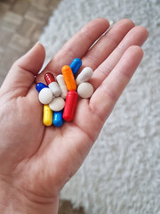a handful of colored tablets