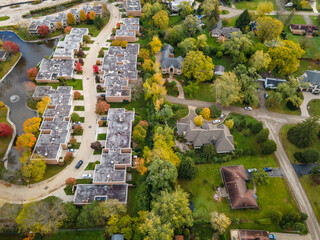 Aerial view of residential neighborhood in Northfield, IL. Lots of trees starting to turn autumn...