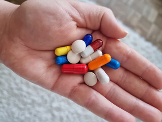 a handful of colored tablets